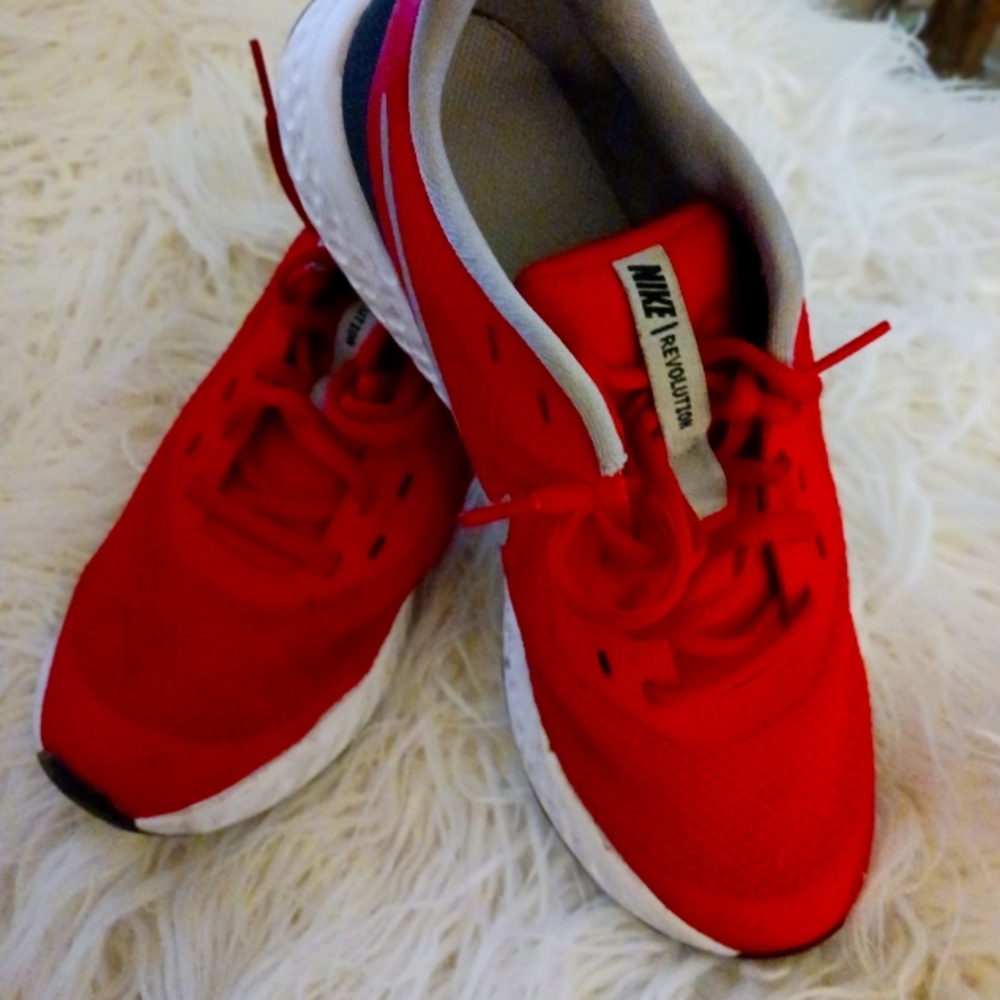 Nike athletic shoes.  Red. Women's size 8.  Worn a handful of times. Like new